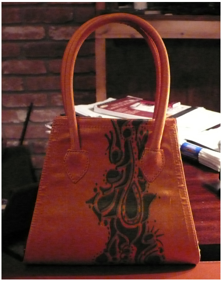 Orange purse with doodle tattoo band