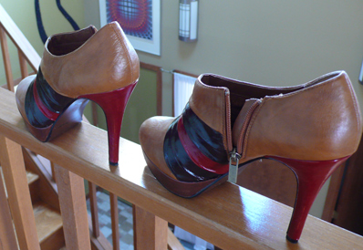 Dark, red, and rose stripes added to pleated tan platform booties