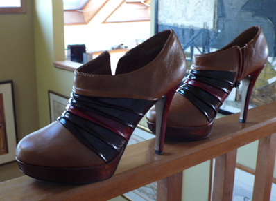 Dark, red, and rose stripes added to pleated tan platform booties